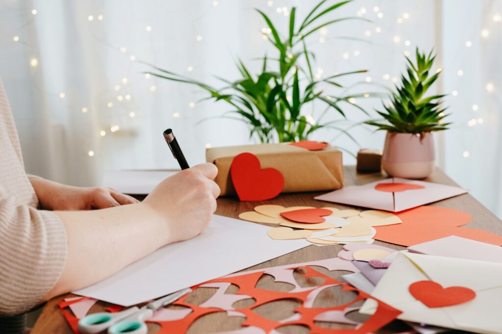 Woman writing a letter by hand for Valentines Day
