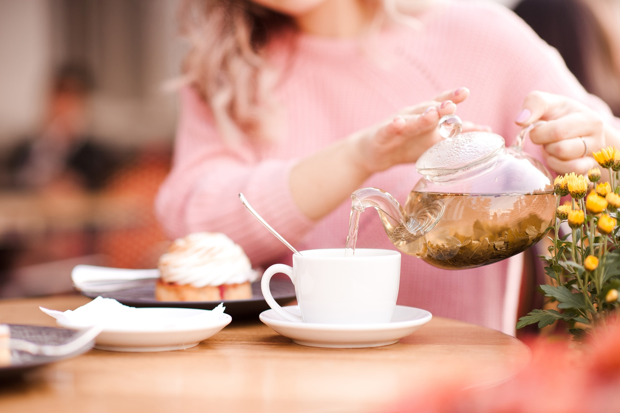 Girl drinking green tea in cafe. Good morning. Breakfast time